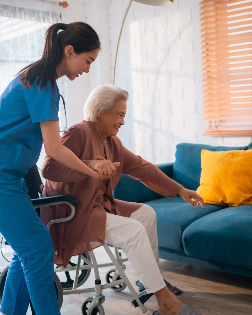 Dedicated Caregiver Woman Nurse Provides Supportive Health Care For Elderly