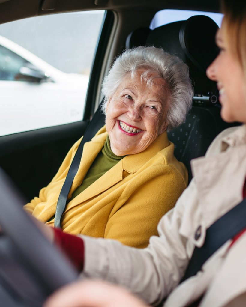 Granddaughter Driving Her Elderly Grandmother In The Car